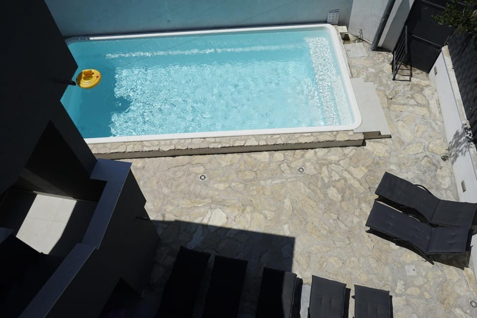 Patio, Day, Pool view, sunbed