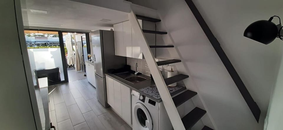 Kitchen or kitchenette, stove, washing machine