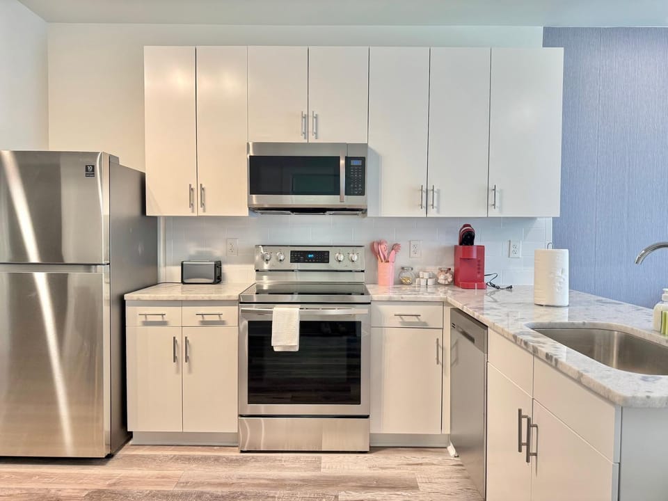 Kitchen or kitchenette, dishwasher, oven, stove, toaster