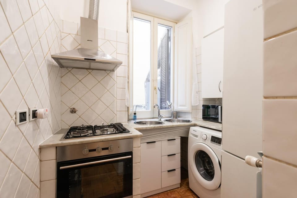 Kitchen or kitchenette, oven, stove, washing machine