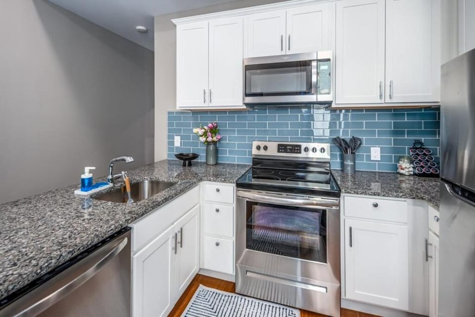 Kitchen or kitchenette, dishwasher, oven, stove, toaster