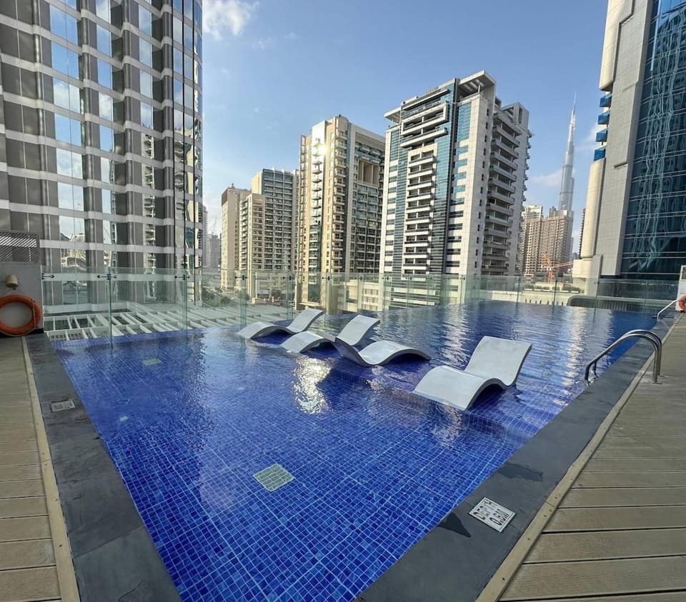 Stylish Studio Bayz Danube Burj Khalifa View Pool Apartment in Dubai