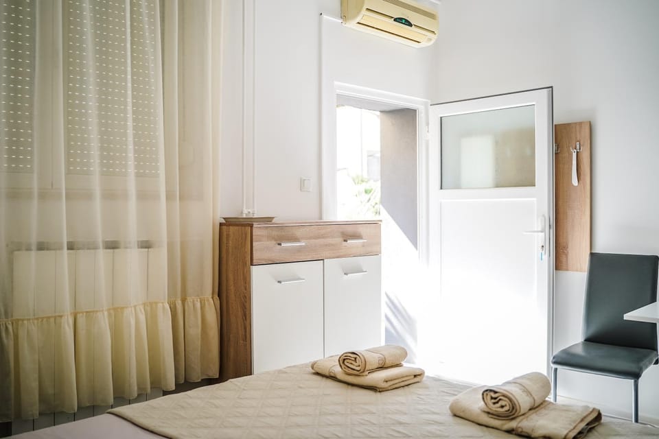 Bed, towels, wardrobe