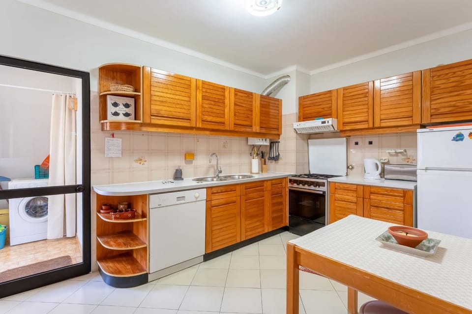 Kitchen or kitchenette, dishwasher, oven, stove, toaster