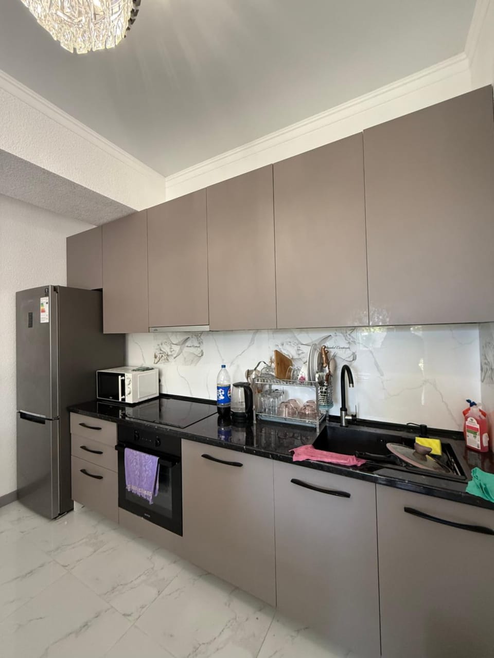 Kitchen or kitchenette, dishwasher, oven, stove