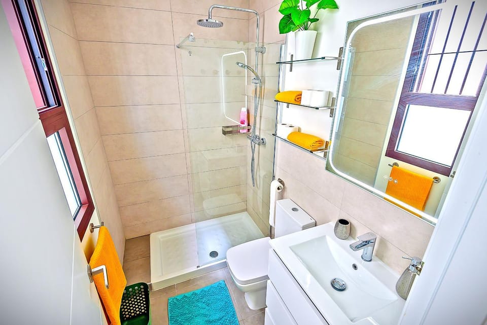 Shower, Toilet, Bathroom, hair dryier, towels