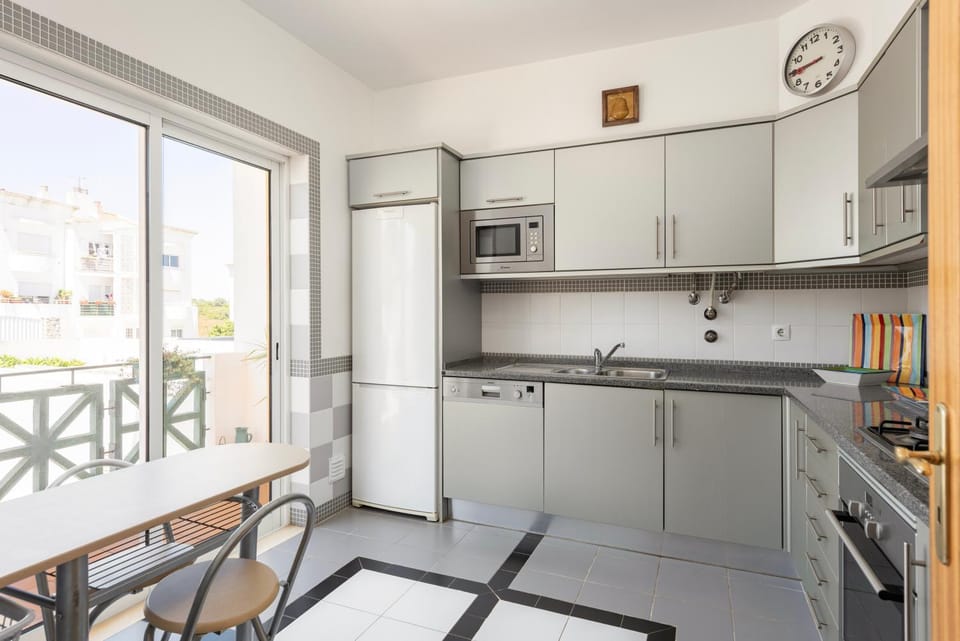 Kitchen or kitchenette, dishwasher, oven, stove
