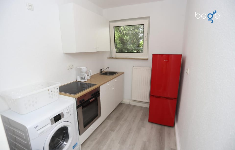 Kitchen or kitchenette, dishwasher, oven, stove, washing machine