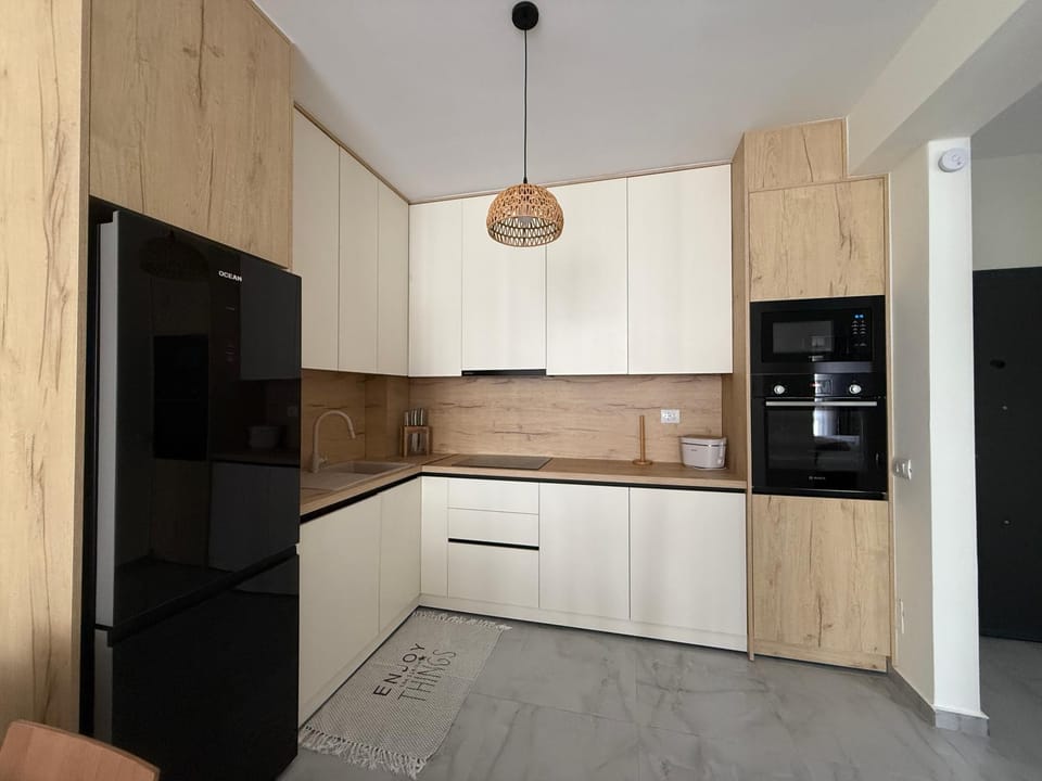 Kitchen or kitchenette, dishwasher, oven, stove