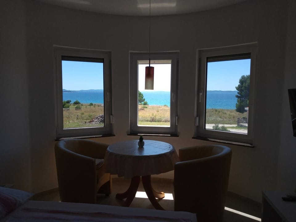 Natural landscape, Living room, Seating area, Dining area, Sea view