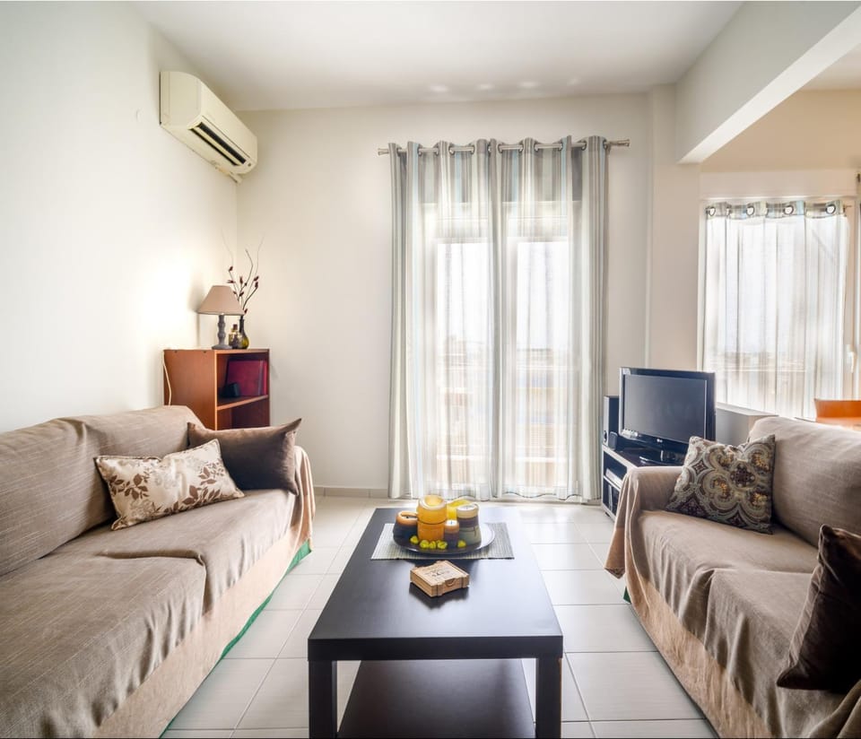 Bed, TV and multimedia, Living room, Seating area, air conditioner