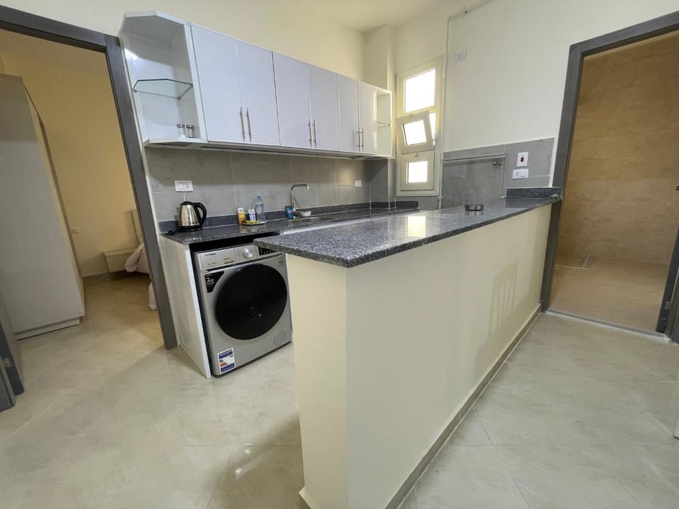 Kitchen or kitchenette, washing machine