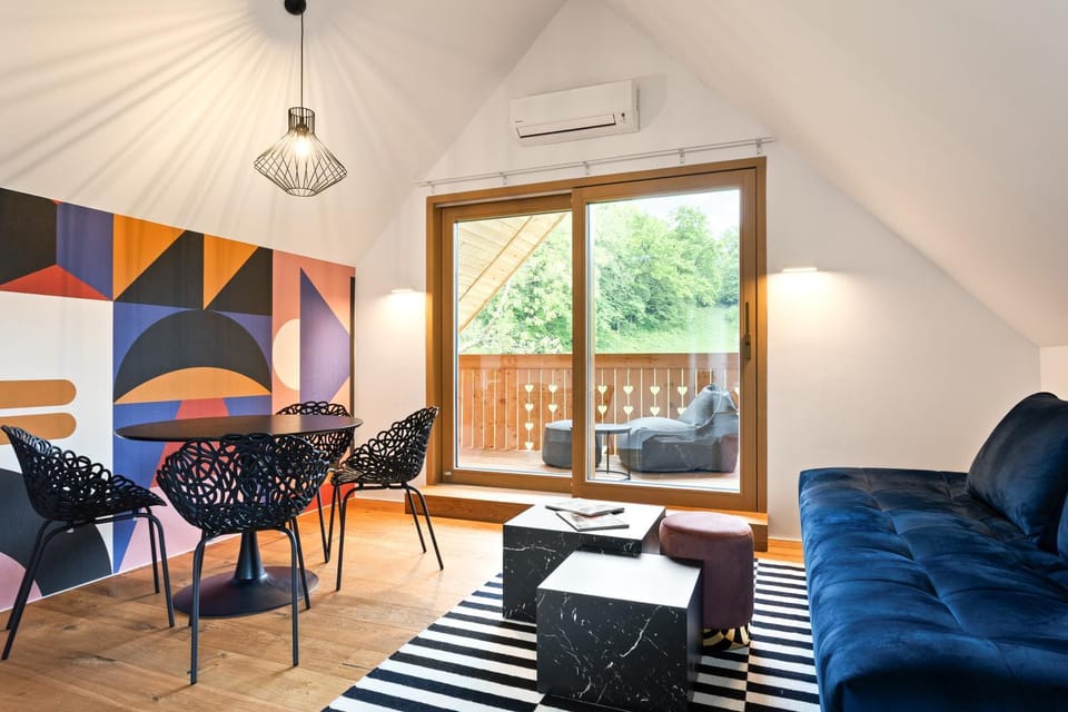 View (from property/room), Living room, Seating area, Dining area, Garden view, air conditioner