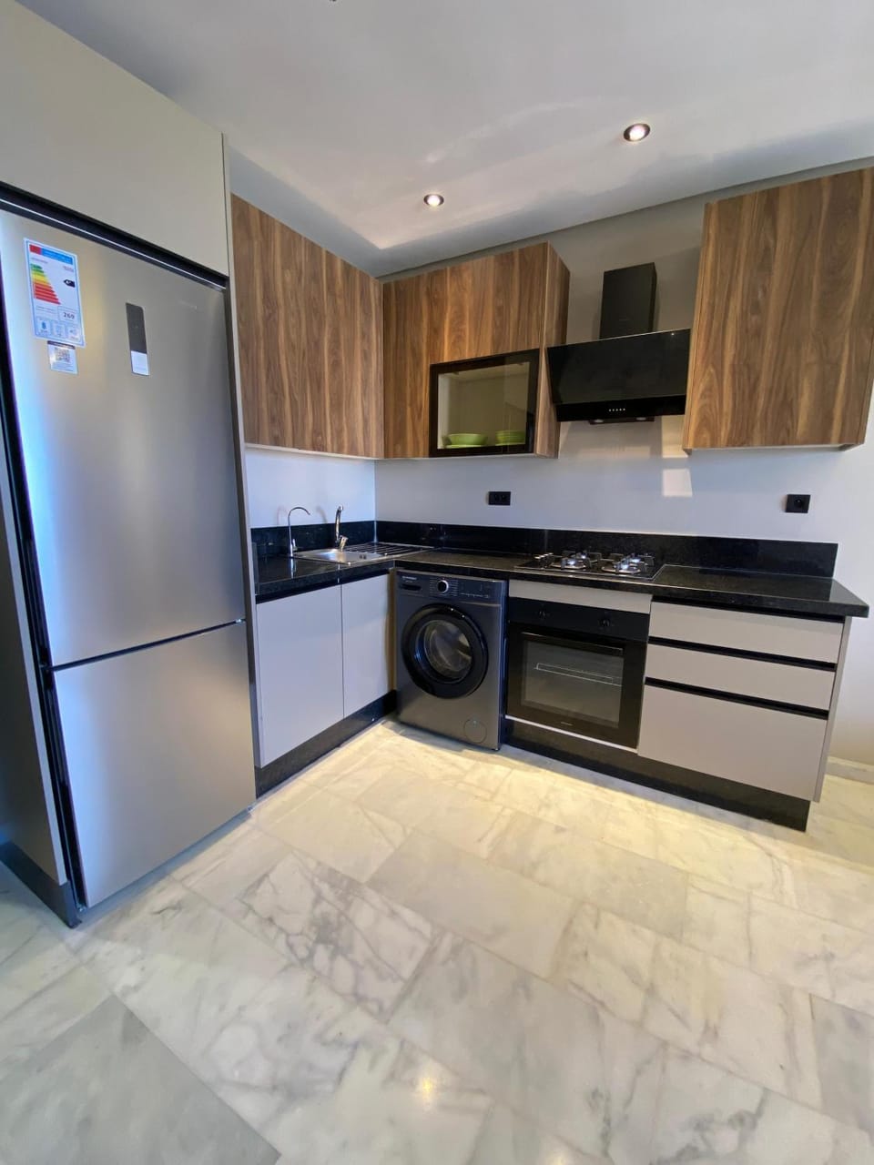 Kitchen or kitchenette, dishwasher, oven, stove