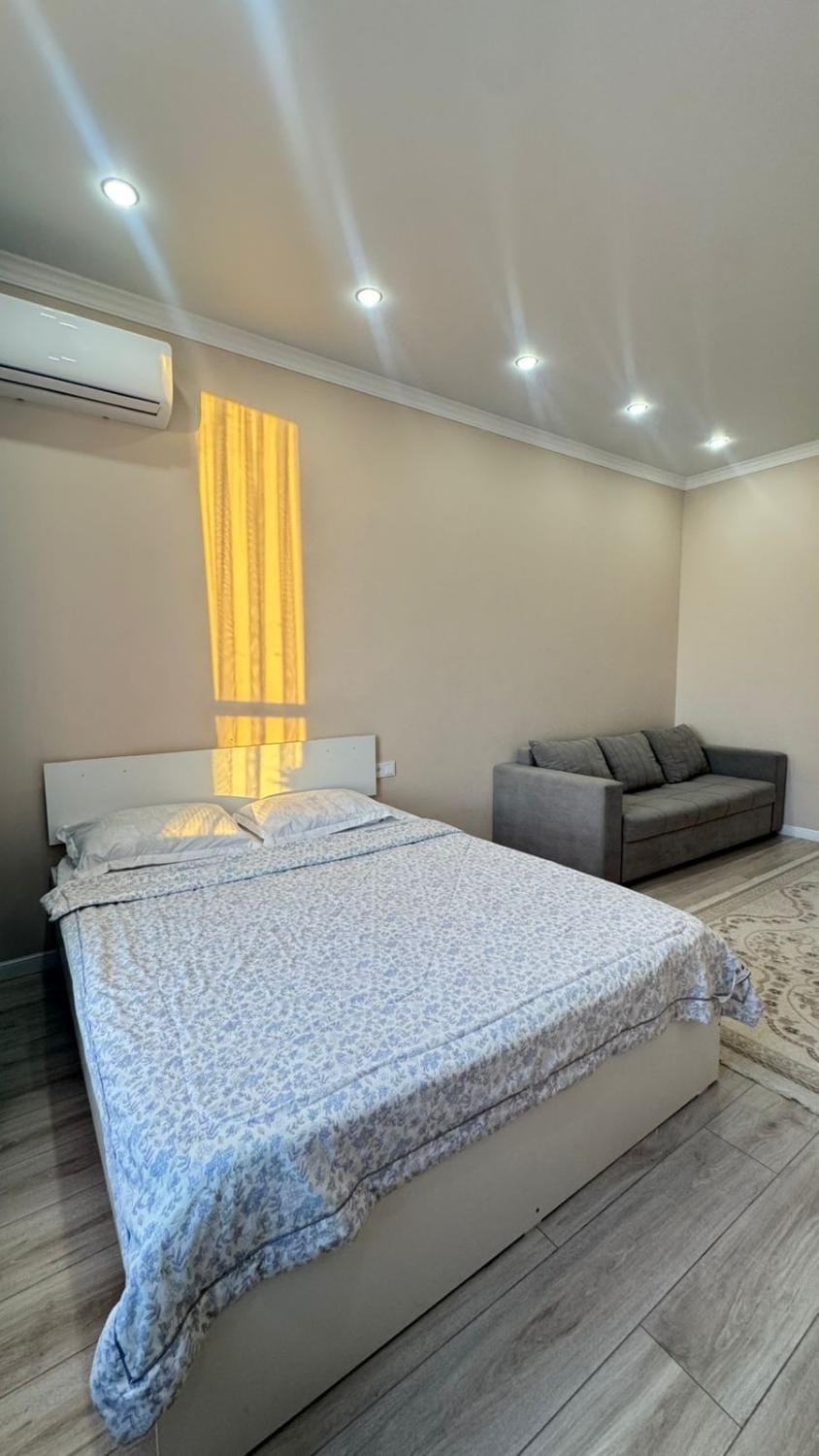 Bed, Living room, Seating area, Bedroom