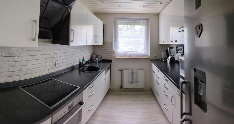 Kitchen or kitchenette, dishwasher, oven, stove