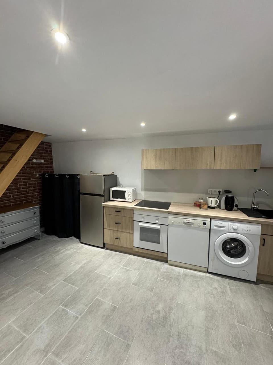 Kitchen or kitchenette, dishwasher, oven, stove, washing machine