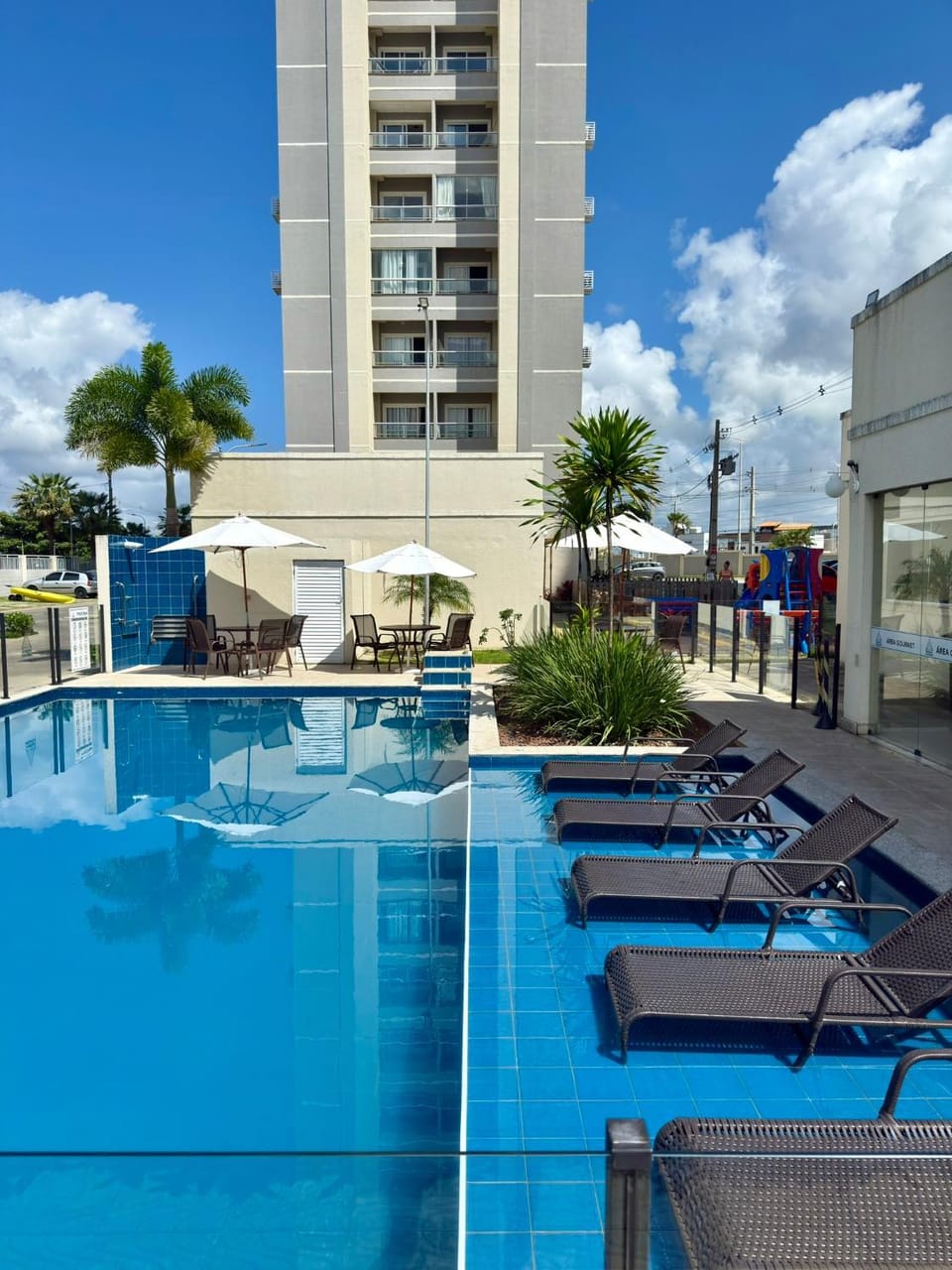 Property building, Day, Pool view, Swimming pool, sunbed