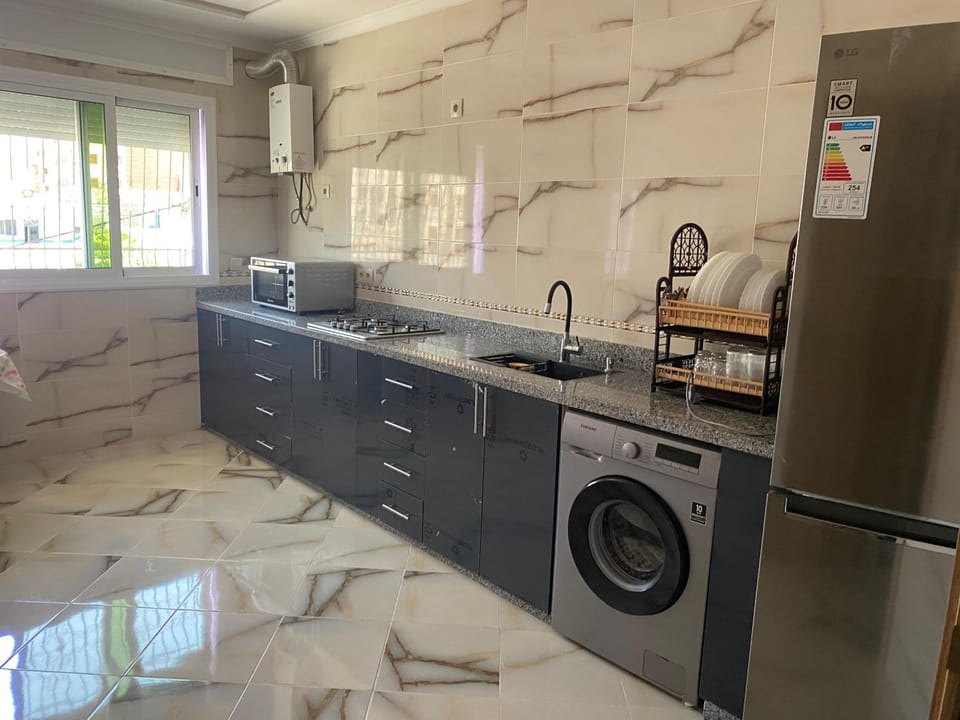 Kitchen or kitchenette, stove, washing machine