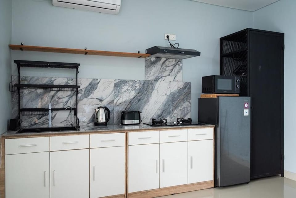 Kitchen or kitchenette, stove, air conditioner