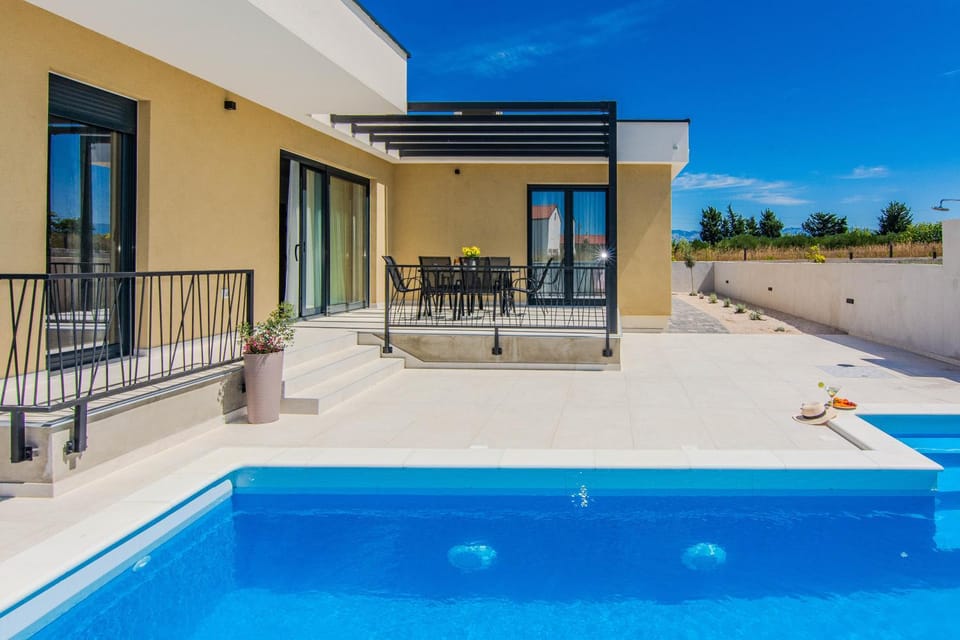 Property building, Patio, Day, View (from property/room), Balcony/Terrace, Pool view, Swimming pool, sunbed