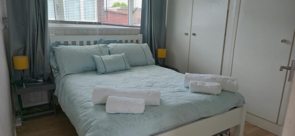 Bed, towels, wardrobe