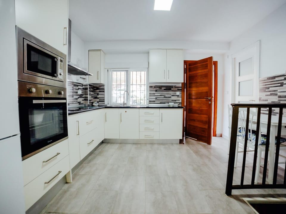 Kitchen or kitchenette, oven, stove