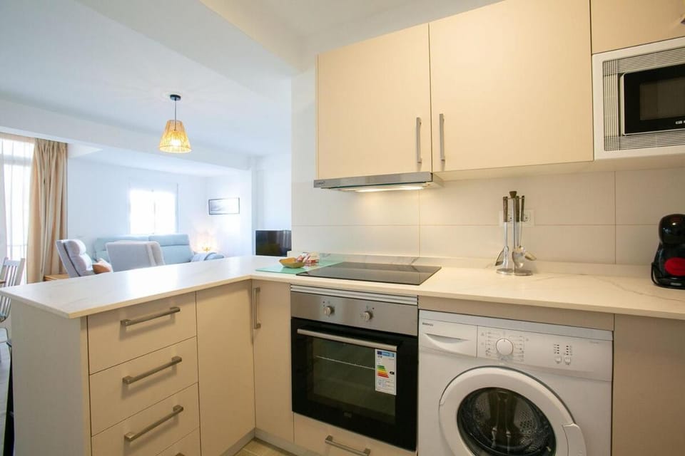 Kitchen or kitchenette, oven, stove, washing machine