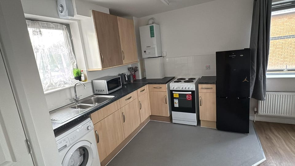 Coffee/tea facilities, Kitchen or kitchenette, dishwasher, oven, stove, washing machine