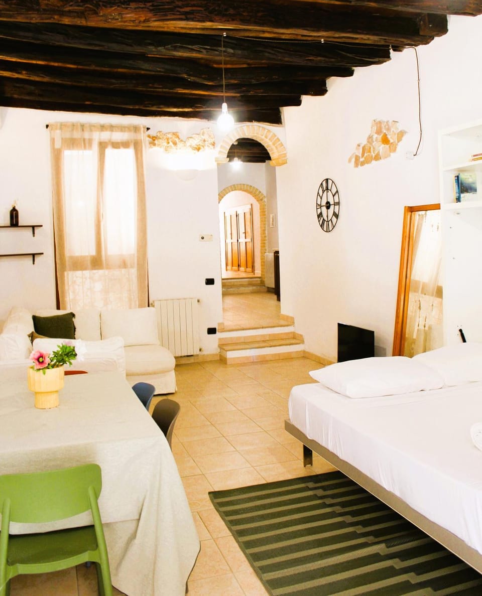 Bed, TV and multimedia, Living room, Seating area, air conditioner