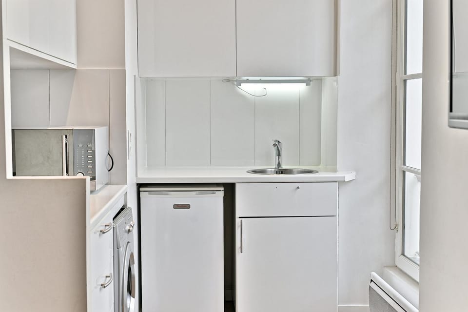 Kitchen or kitchenette, microwave, stove, washing machine