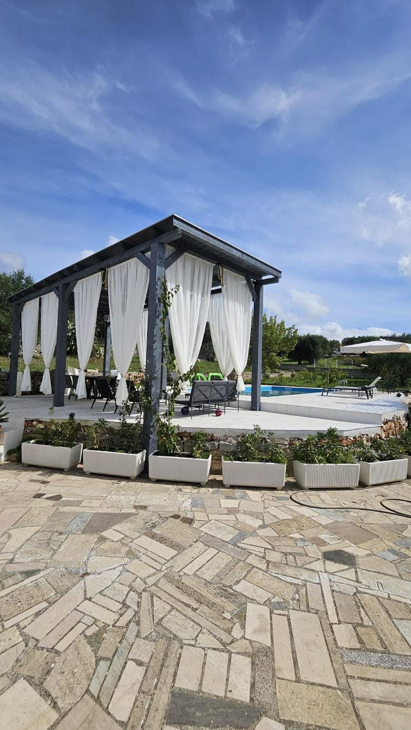 Property building, Day, Natural landscape, Pool view, Swimming pool, Swimming pool, sunbed