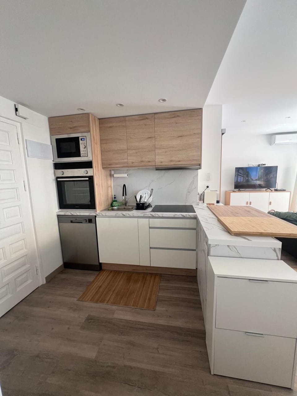 Kitchen or kitchenette, dishwasher, oven, stove