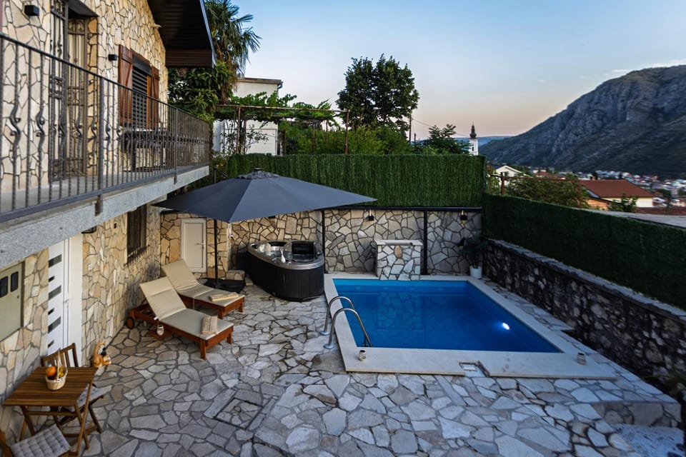 Property building, Patio, Pool view, Swimming pool, sunbed