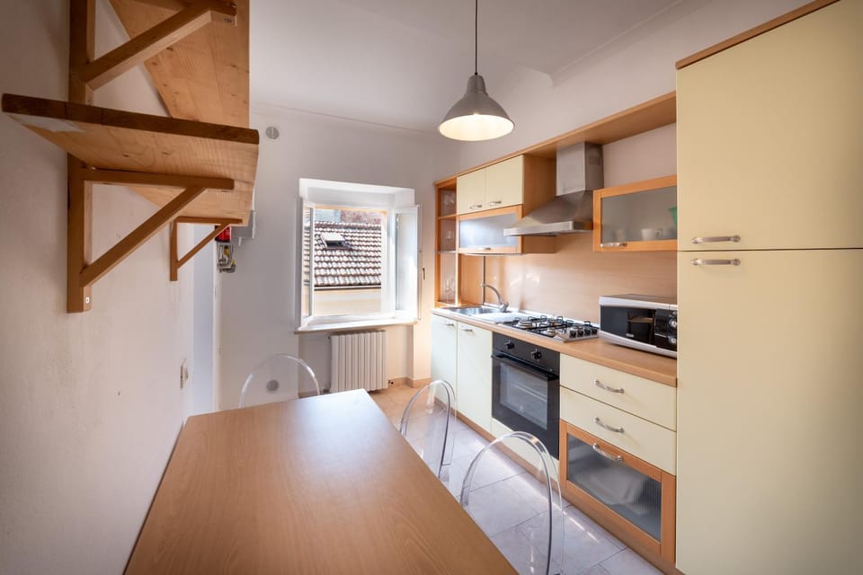 Kitchen or kitchenette, dishwasher, oven, stove