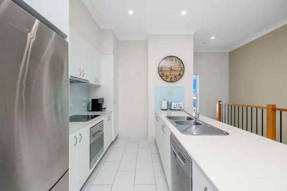 Kitchen or kitchenette, dishwasher, oven, stove, washing machine