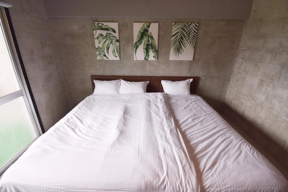 2-101号広いワンルームナカマコンド恩納小学生まで添い寝無料 Apartment hotel in Okinawa Prefecture