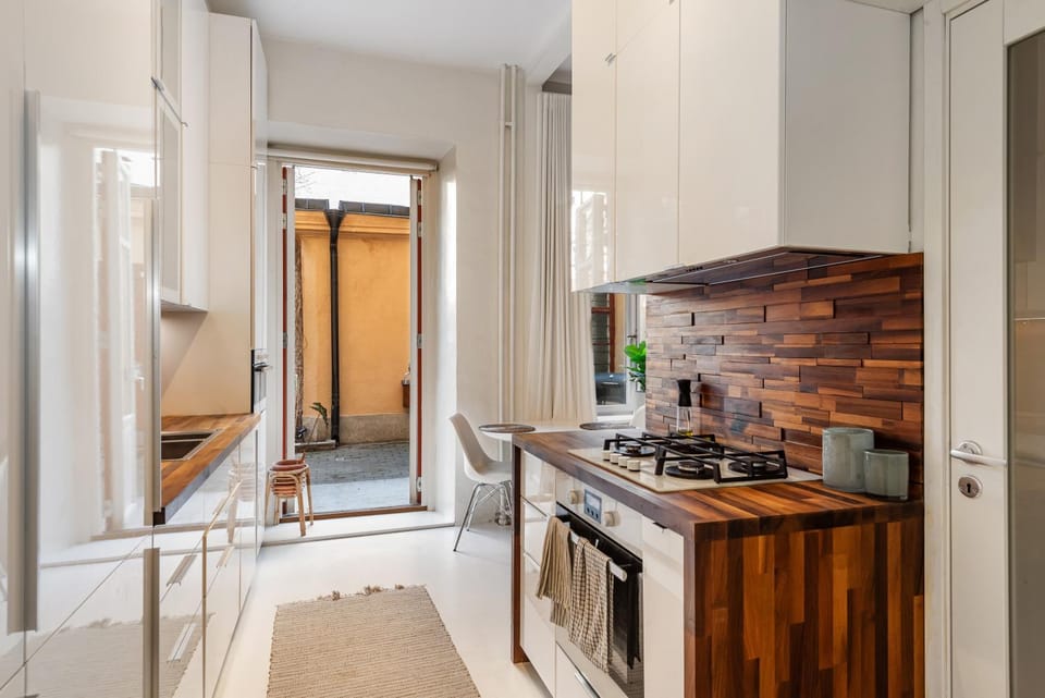 Kitchen or kitchenette, dishwasher, oven, stove