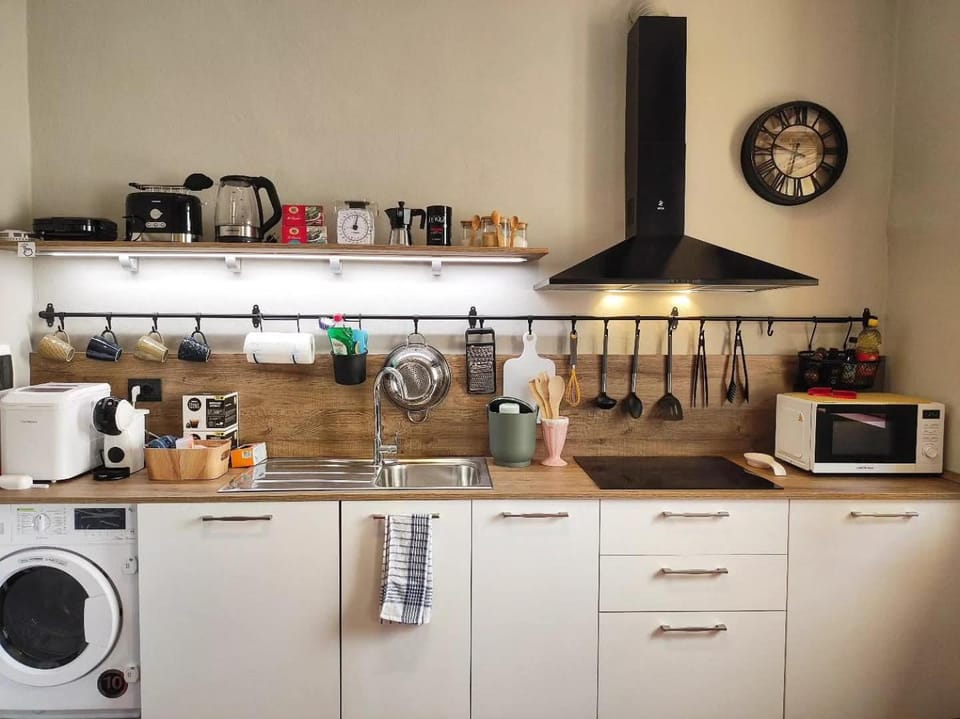 Kitchen or kitchenette, oven, stove, washing machine, dryer
