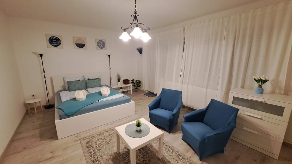Bed, Living room, Seating area, Bedroom