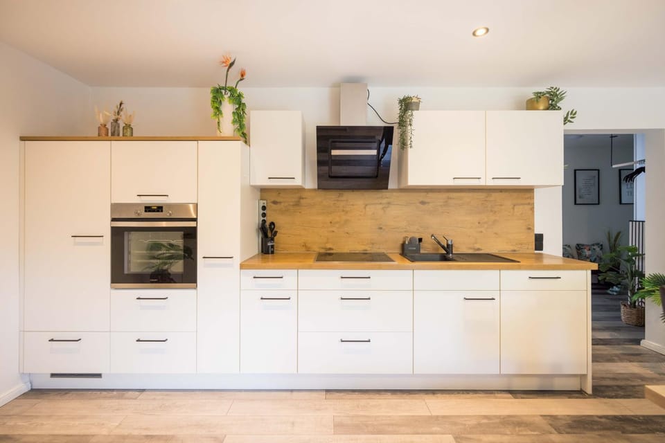 Kitchen or kitchenette, dishwasher, oven, stove