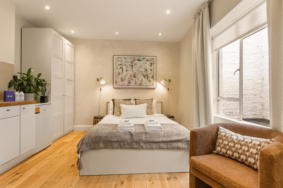 Bed, towels, wardrobe