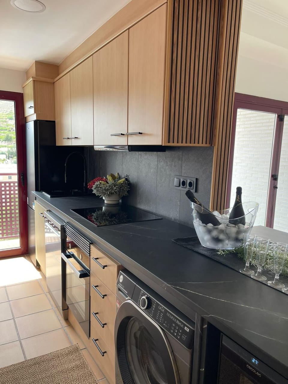 Kitchen or kitchenette, dishwasher, stove, washing machine