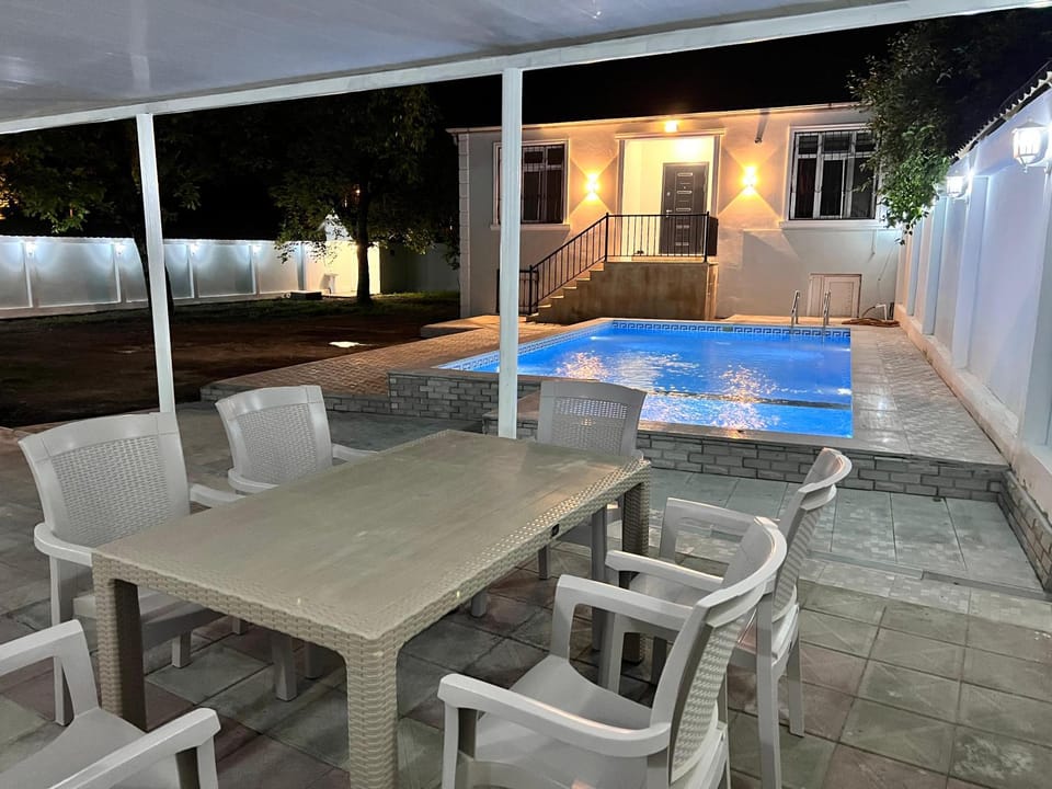 Patio, Night, Dining area, Pool view, Swimming pool