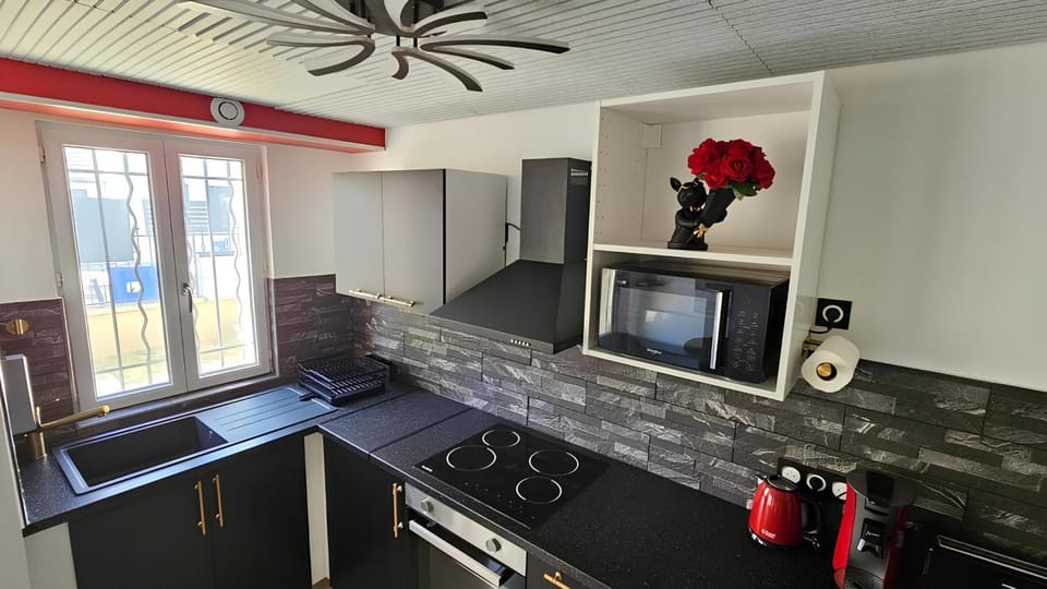 Kitchen or kitchenette, dishwasher, oven, stove