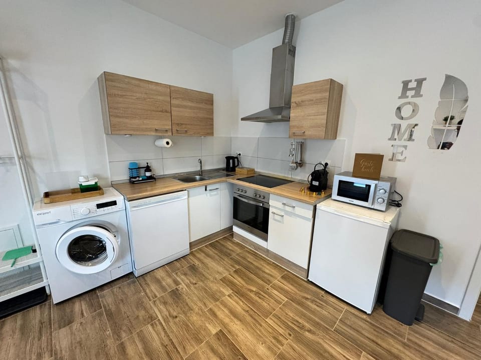 Kitchen or kitchenette, dishwasher, oven, stove, washing machine