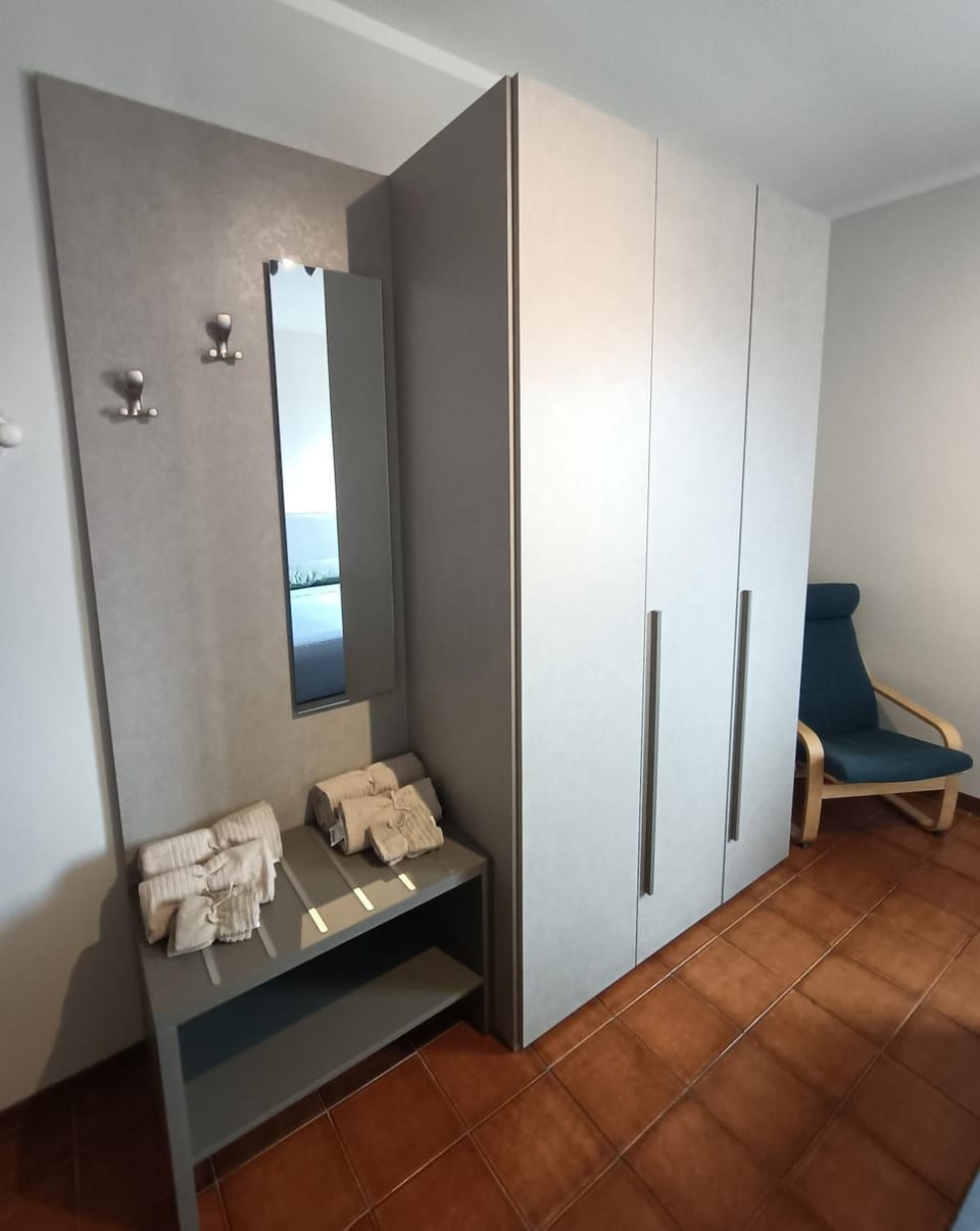 Seating area, Bedroom, towels, wardrobe