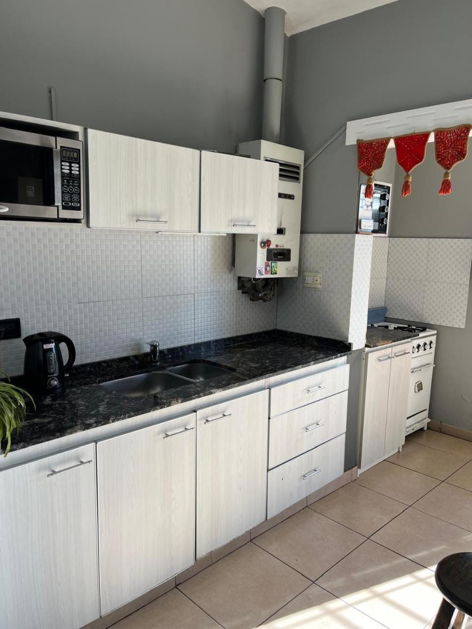 Kitchen or kitchenette, microwave, oven