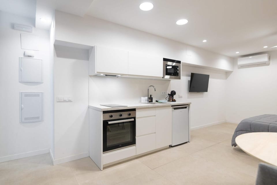 Kitchen or kitchenette, oven, stove, air conditioner