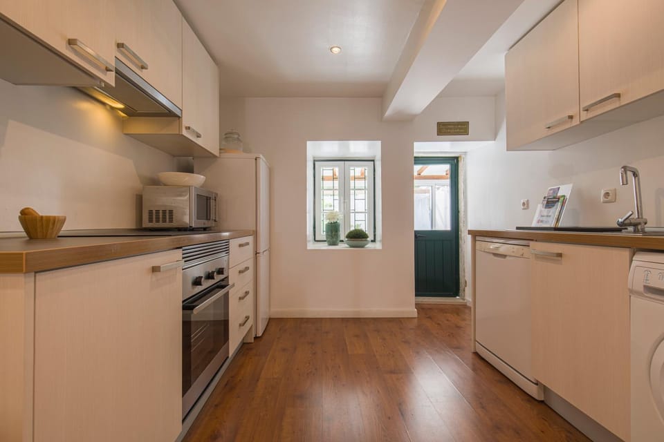 Kitchen or kitchenette, dishwasher, oven, stove